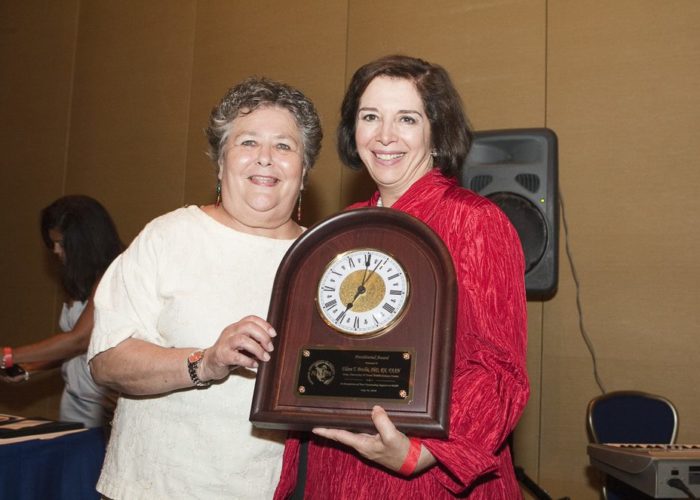 Dean Eileen T. Breslin Ph.D., RN, FAAN, pictured with Norma Martinez Rogers PhD, RN, FAAN, receiving the Presidential Award from the National Association of Hispanic Nurses.