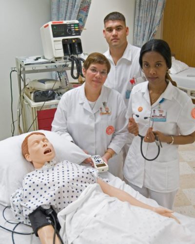 Kathleen Reeves M.S.N., RN, (center)  with students in the Learning Lab.