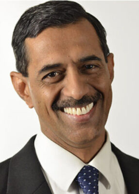 Dr. Ramachandran smiling in a headshot photo