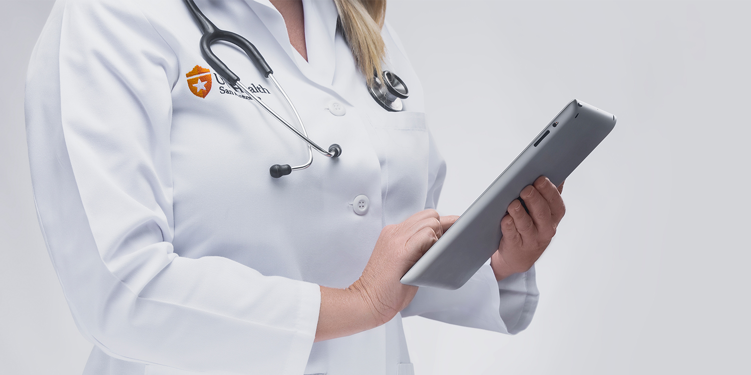 woman doctor holding tablet
